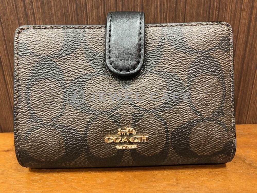 コーチ シグネチャー二つ折り財布 F23553